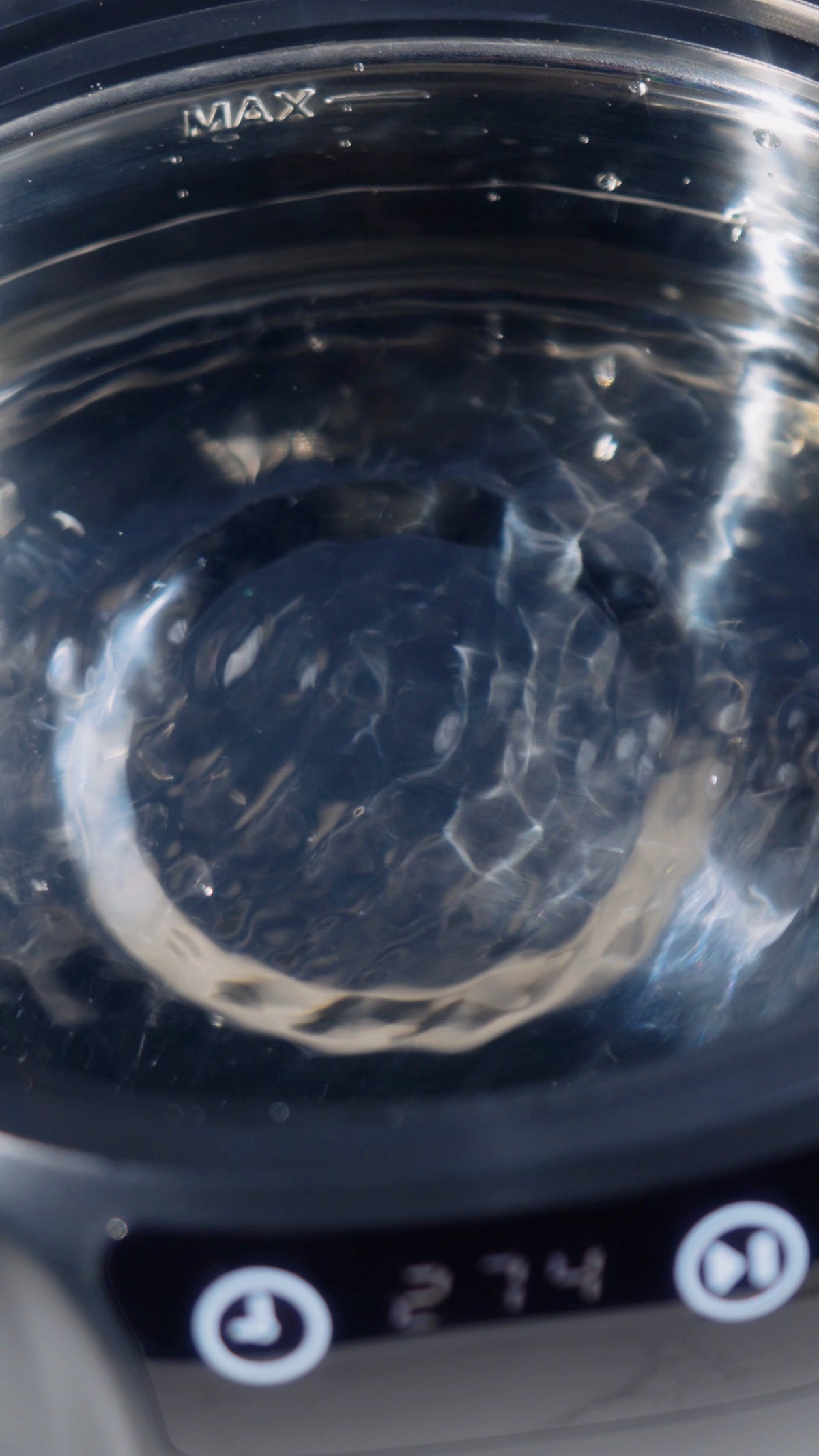 Water rippling inside the SONIQ Clean stainless-steel tank
